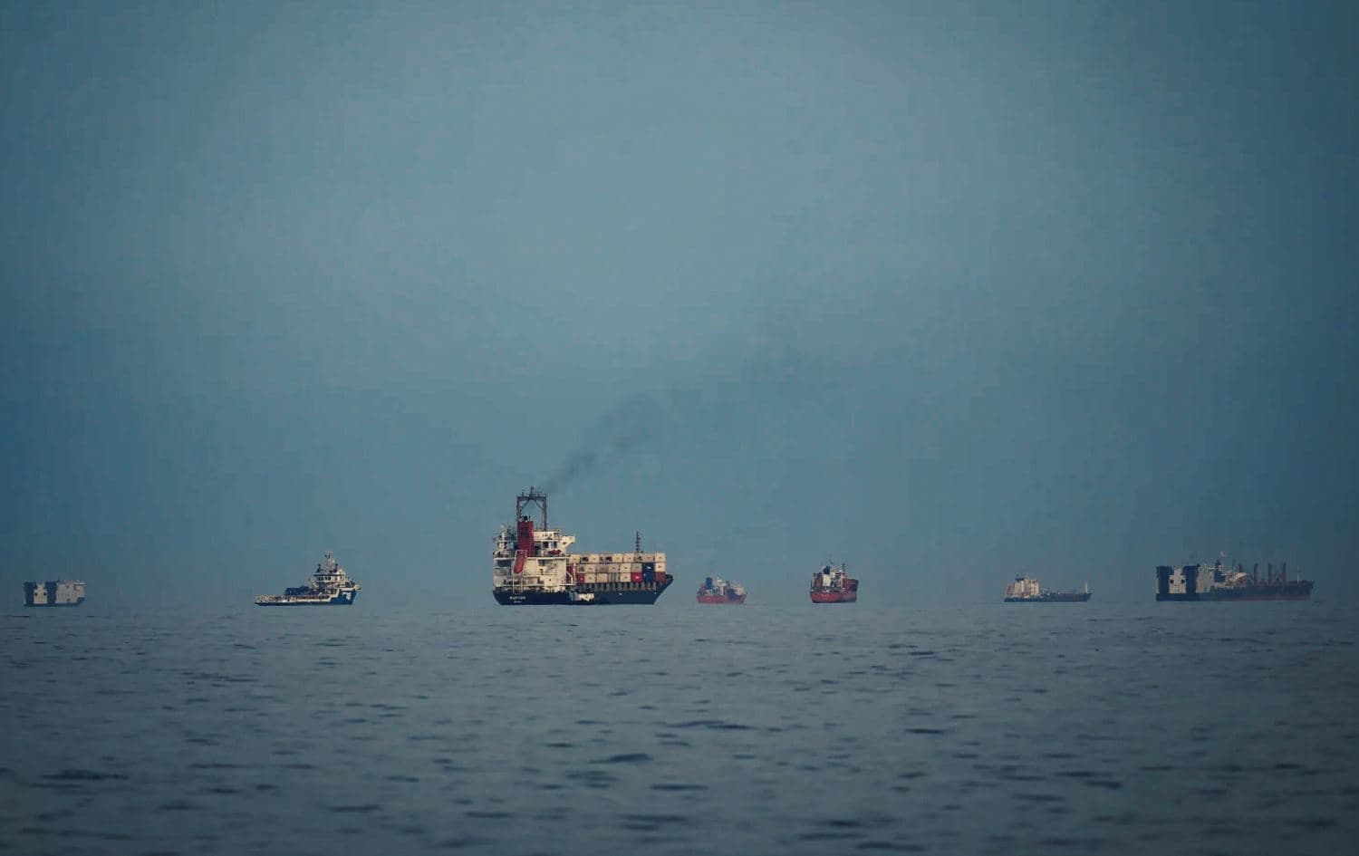 Oil tankers and cargo ships line up in the Strait of Hormuz as seen from Khor Fakkan, United Arab Emirates, Wednesday, March 11, 2026. (AP Photo)